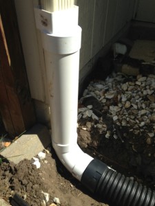 Downspout drainage connection at Hometown Lawn, Olathe Kansas