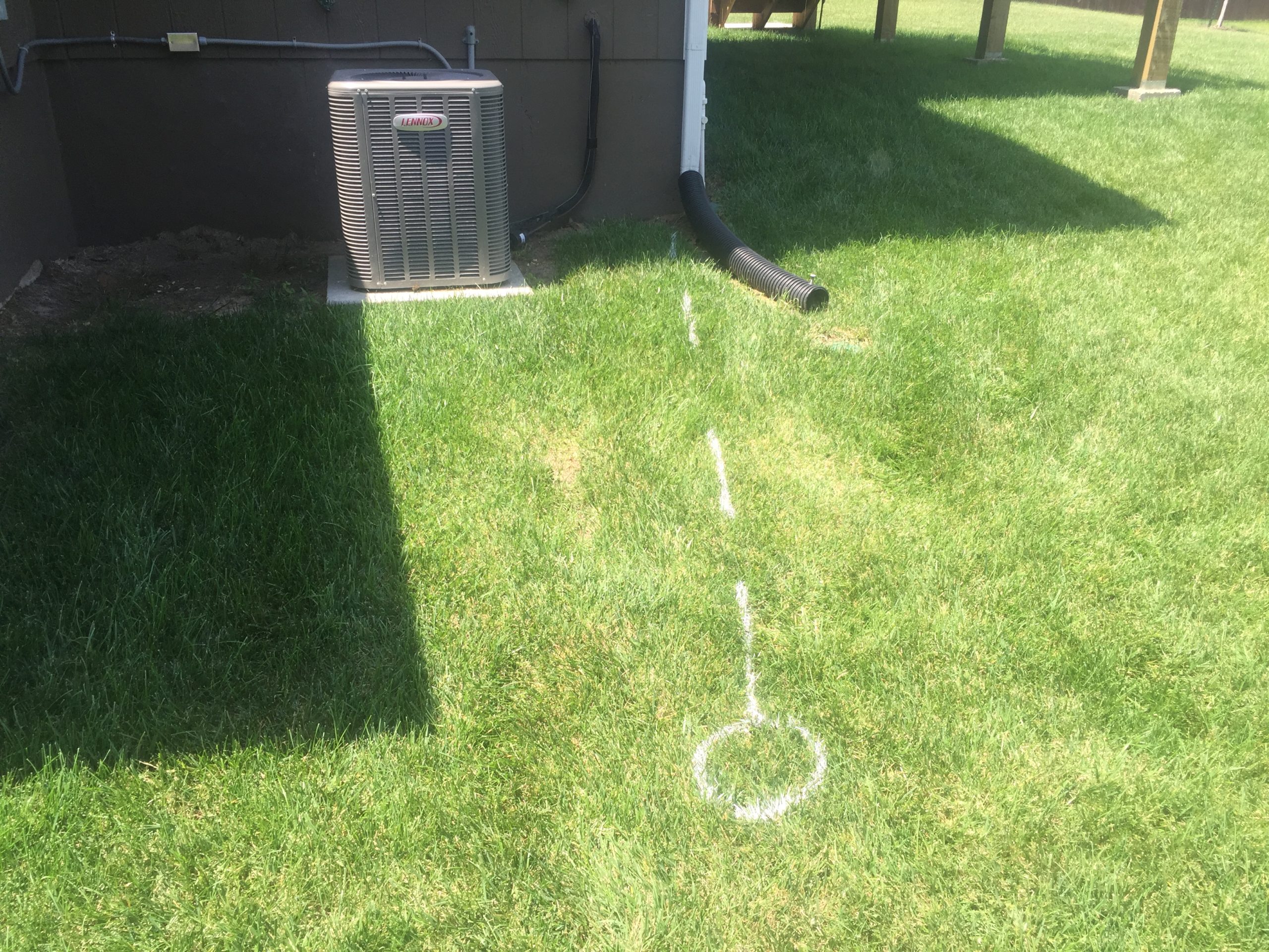 Professionally engineered drainage layout and installation by Hometown Lawn in Kansas City.